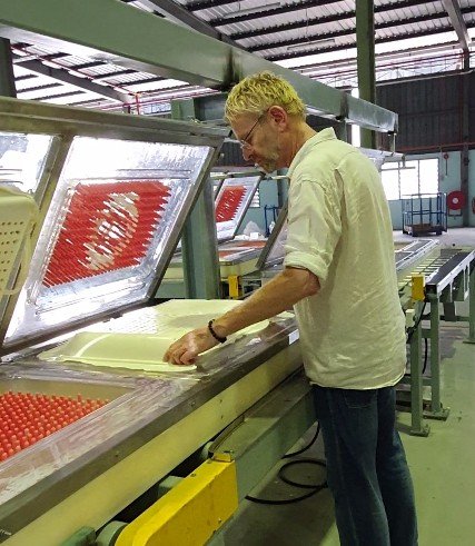On the production line during a trial run in Malaysia, stripping foam cores from open molds
