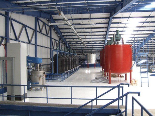 Compounding section with dispersion and pearl mills, and compounding tanks