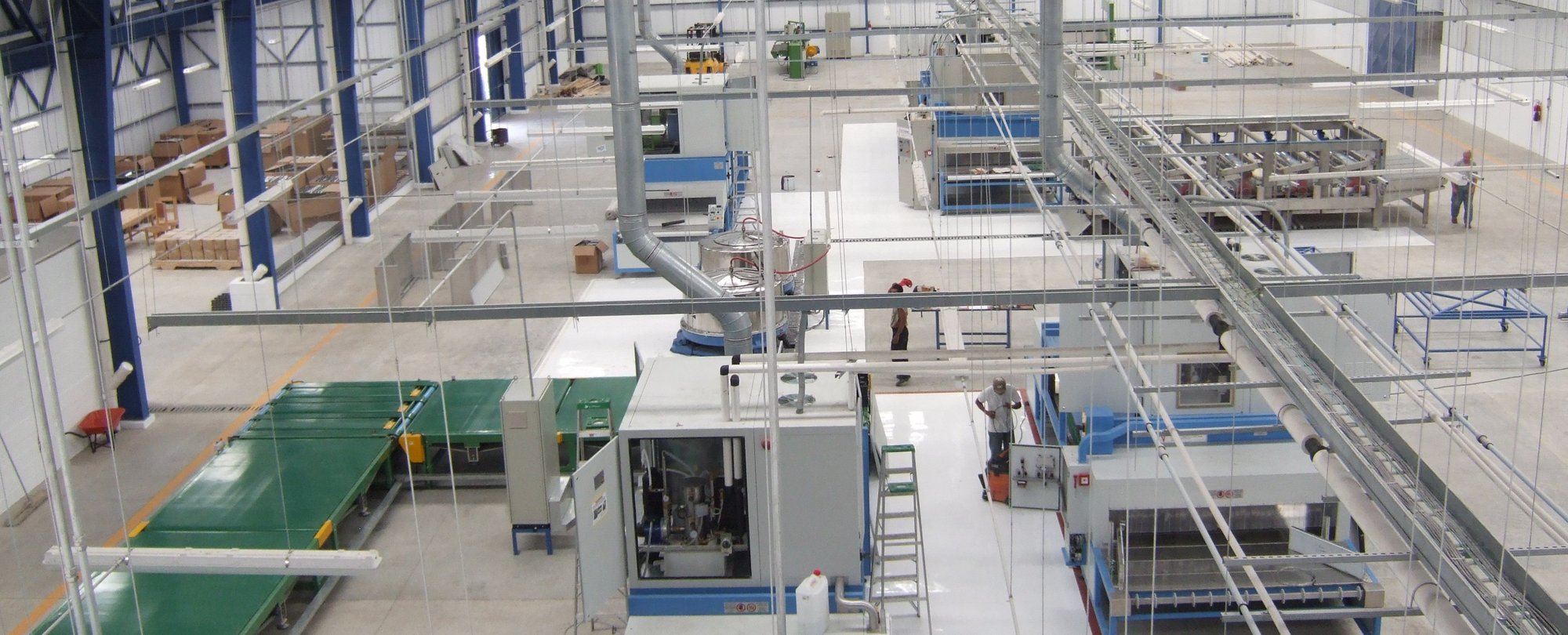 Elevated view of the Guatemala production floor, with conveyors and RF process equipment